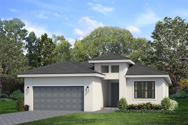 view of front of property featuring a front yard and a garage