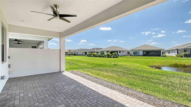 4910 Carova Way, Lakewood Ranch, FL 34211 - view of patio featuring a residential view, ceiling fan, and a water view