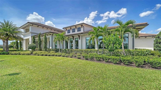 4910 Carova Way, Lakewood Ranch, FL 34211 - view of front facade with stucco siding and a front lawn