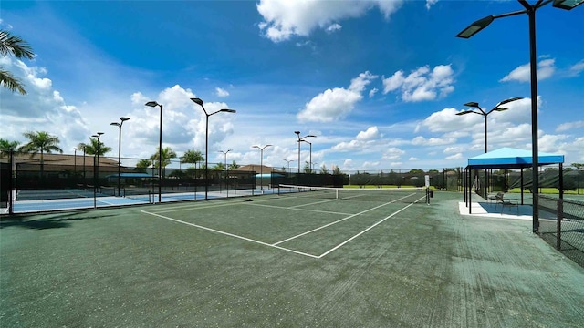 4910 Carova Way, Lakewood Ranch, FL 34211 - view of tennis court featuring fence