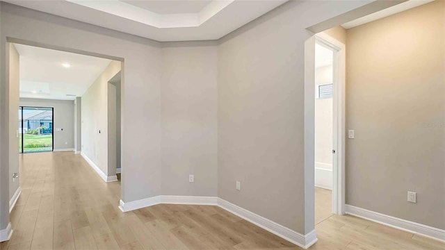 4910 Carova Way, Lakewood Ranch, FL 34211 - hall with baseboards and light wood-style flooring