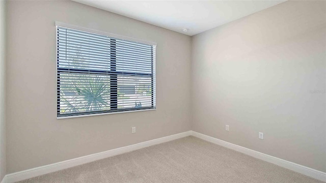 4910 Carova Way, Lakewood Ranch, FL 34211 - spare room featuring baseboards and carpet