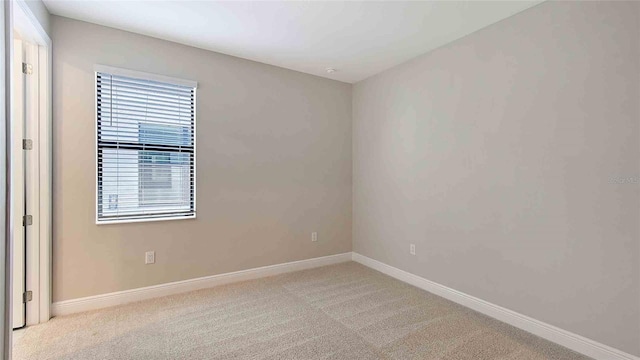 4910 Carova Way, Lakewood Ranch, FL 34211 - spare room featuring carpet floors and baseboards