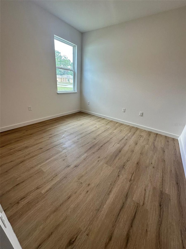 spare room featuring light wood-type flooring