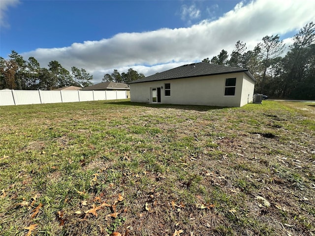 view of yard with central AC