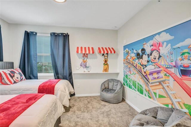 carpeted bedroom with baseboards