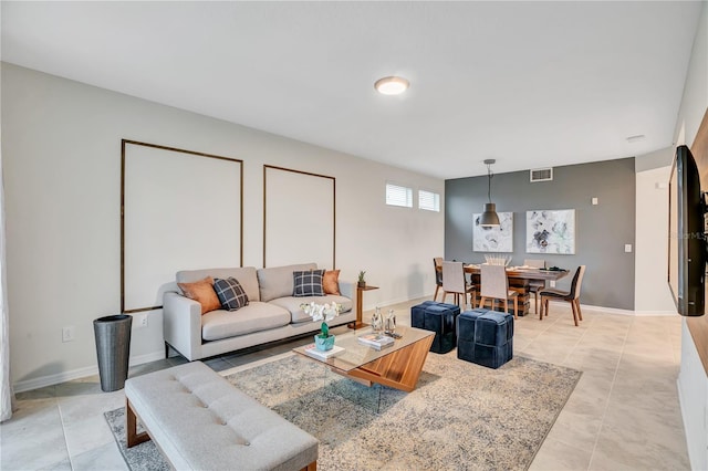 living room featuring light tile patterned flooring