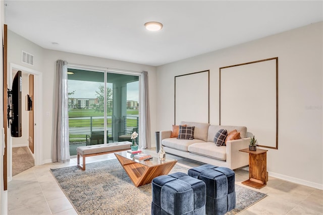 living room with light tile patterned flooring