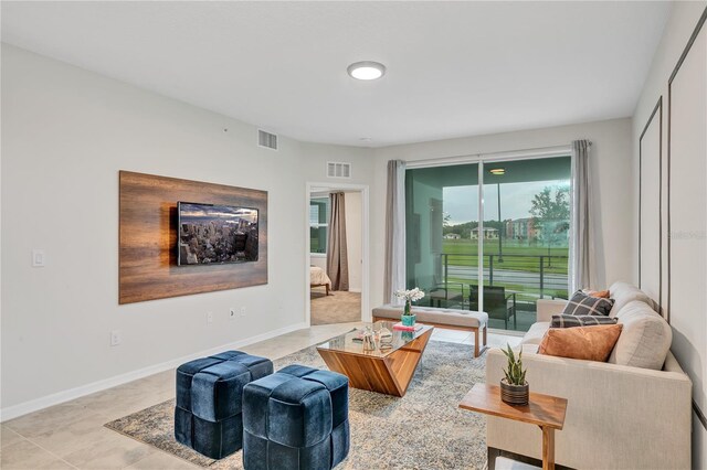 living room featuring visible vents and baseboards