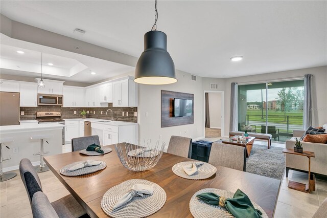 dining space with visible vents, recessed lighting, and light tile patterned flooring