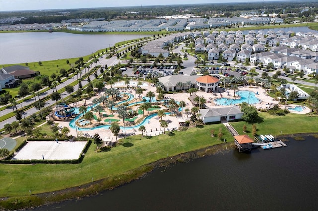 birds eye view of property with a water view