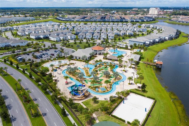 birds eye view of property with a water view