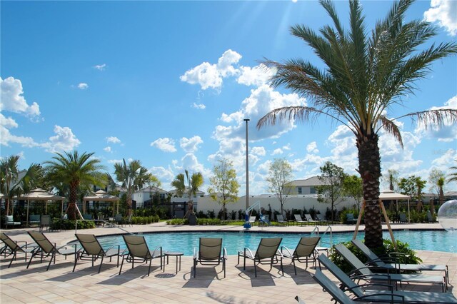 pool with a patio area