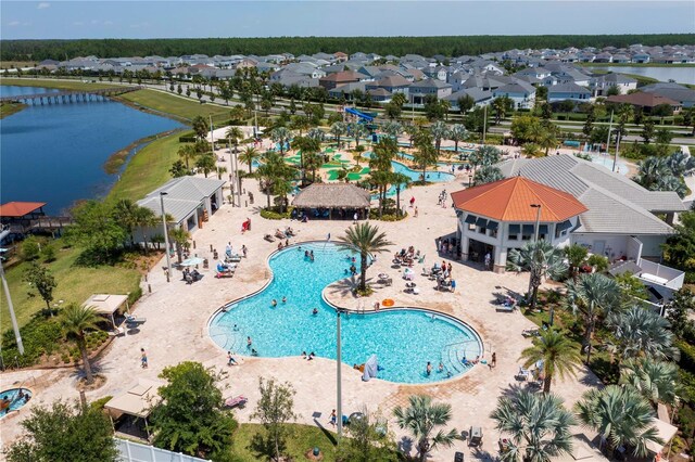 bird's eye view with a residential view and a water view