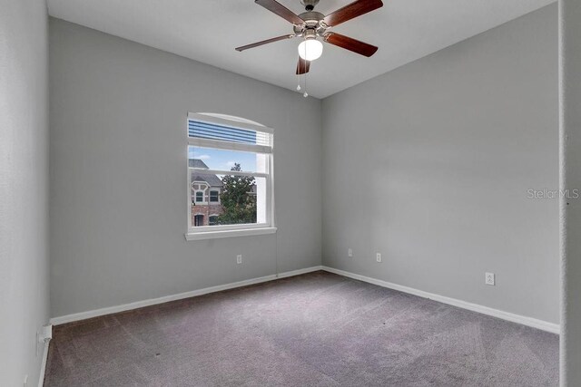 carpeted empty room with ceiling fan