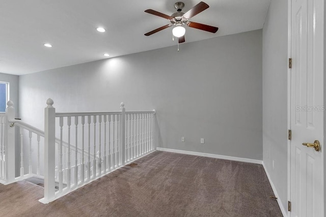 carpeted empty room with recessed lighting and baseboards