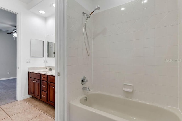 bathroom with tile patterned flooring, shower / bathing tub combination, ceiling fan, and vanity