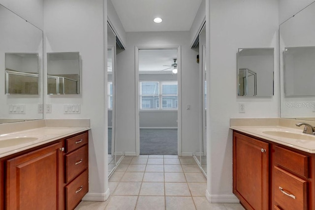 bathroom with ceiling fan, tile patterned floors, and a shower with shower door