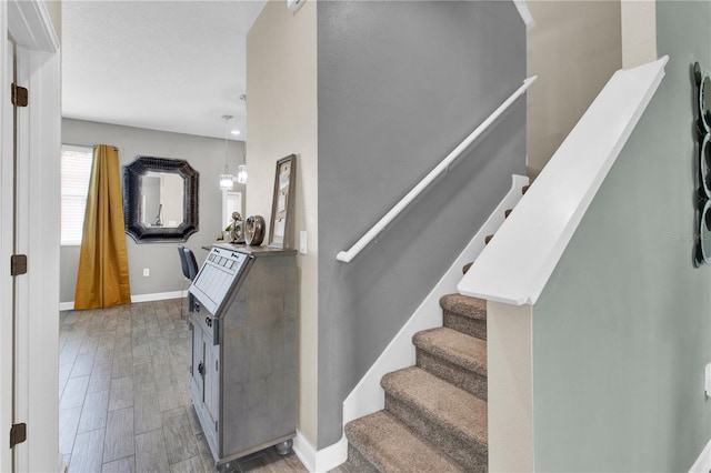 stairway featuring hardwood / wood-style floors