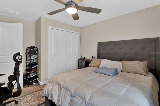 bedroom with carpet flooring, ceiling fan, and a closet