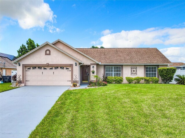 ranch-style house with a front yard and a garage