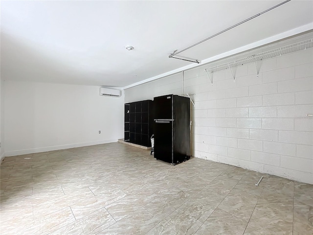 unfurnished room featuring a wall unit AC