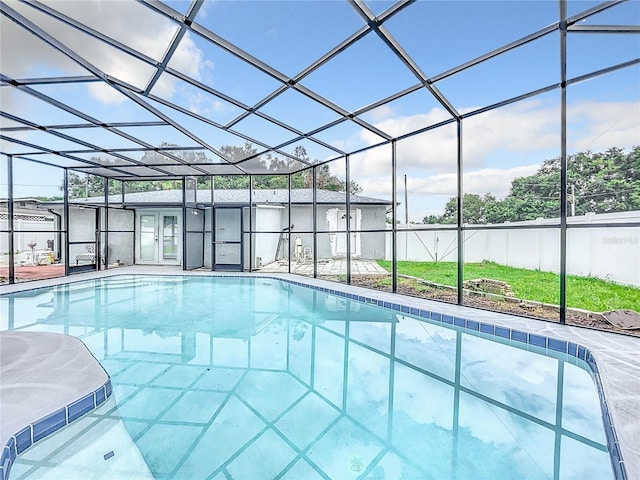 view of pool featuring a lanai, a patio area, a fenced in pool, and fence