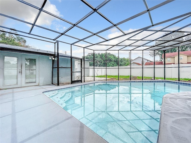 view of pool featuring a lanai, a patio area, and a fenced in pool