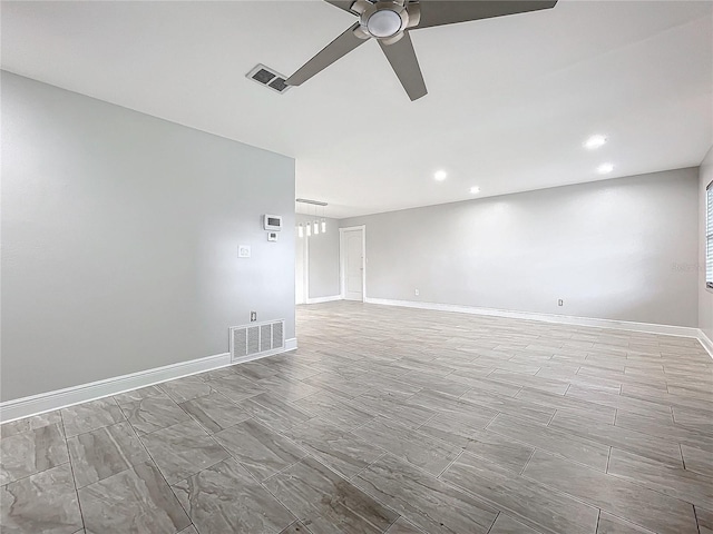 spare room with recessed lighting, visible vents, baseboards, and ceiling fan