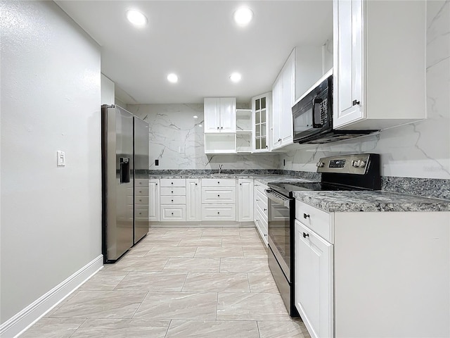 kitchen featuring backsplash, white cabinets, and appliances with stainless steel finishes