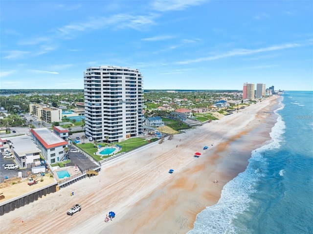 bird's eye view with a view of the beach, a water view, and a view of city