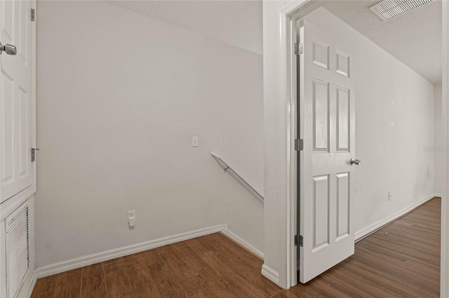 interior space featuring hardwood / wood-style floors and a textured ceiling