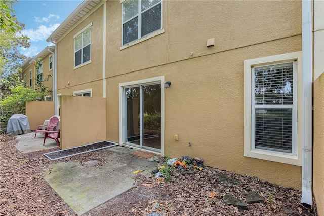 rear view of house featuring a patio