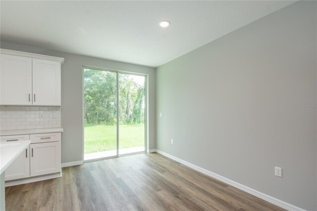 interior space featuring light wood-style floors and baseboards