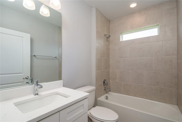 bathroom featuring shower / tub combination, toilet, and vanity