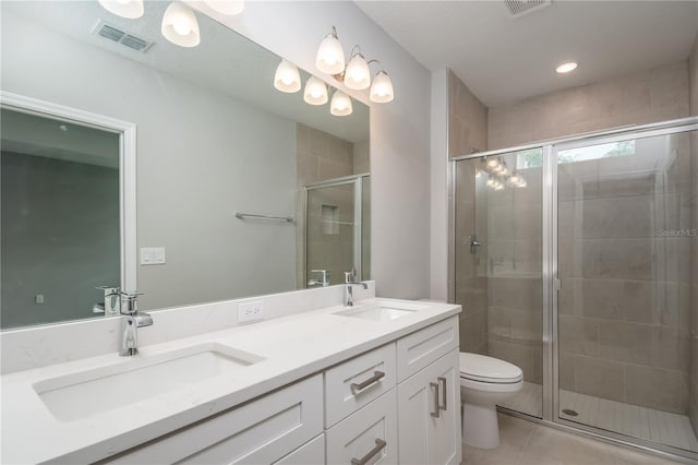 bathroom featuring a shower stall, tile patterned floors, visible vents, and a sink