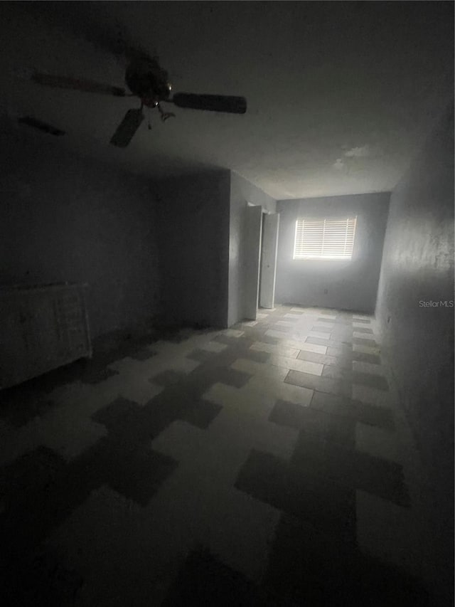 unfurnished room featuring ceiling fan