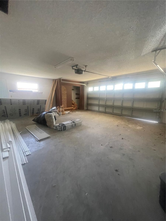 interior space with a textured ceiling and concrete floors