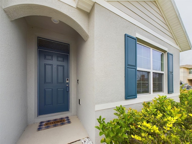 1502 Jadewood Way, Kissimmee, FL 34744 - property entrance with stucco siding