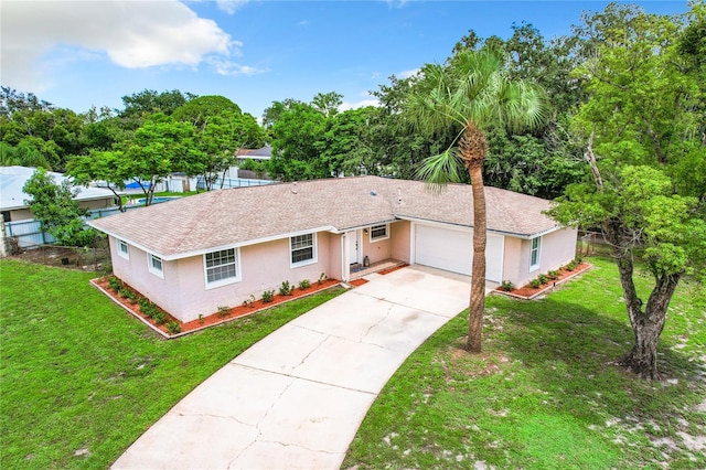 ranch-style house with a garage and a front yard