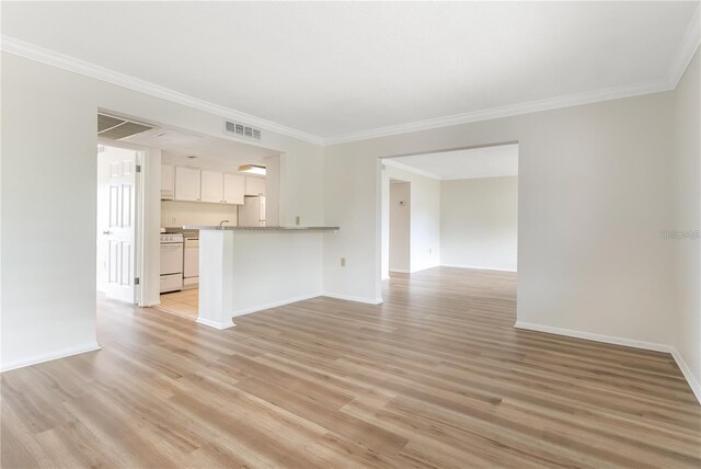 unfurnished living room featuring light hardwood / wood-style floors