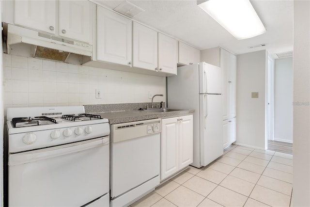 kitchen featuring backsplash, white cabinetry, light tile patterned floors, sink, and white appliances