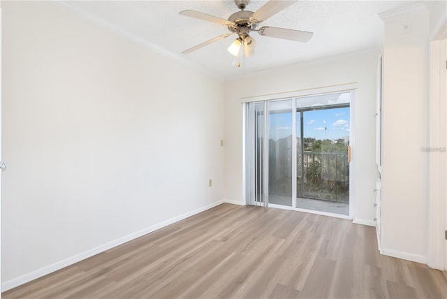 empty room with ceiling fan, light hardwood / wood-style flooring, and ornamental molding