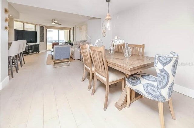 dining area with light wood-type flooring