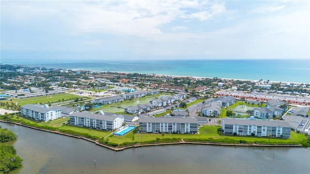 drone / aerial view with a water view