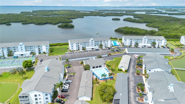 birds eye view of property with a water view