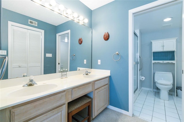 bathroom with tile patterned flooring, toilet, walk in shower, and vanity