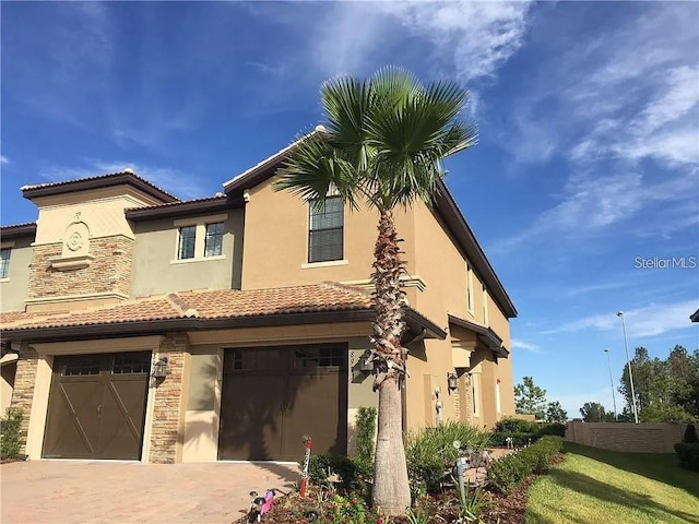 view of front of property with a garage