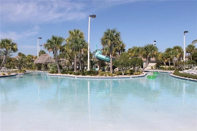 view of pool with a water slide