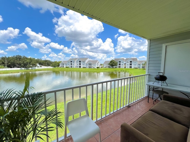 balcony featuring a water view